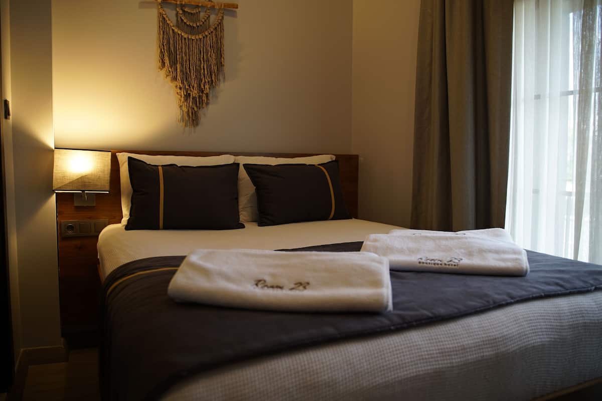 Economy-Zimmer, 1 Doppelbett, Gartenblick | Hochwertige Bettwaren, Minibar, Verdunkelungsvorhänge