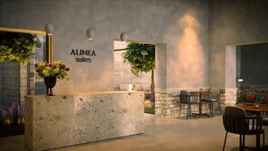 A reception area with a concrete counter, a sign reading 'ALINEA suites,' and a seating area with tables and chairs. - Alinea Suites Limassol Center (Limassol)