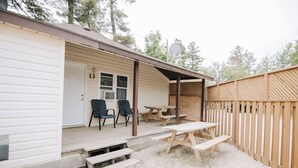 A single-story building with a covered patio area.