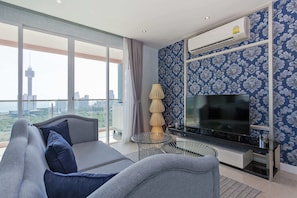 Presidential Apartment, 2 Bedrooms, Sea View | Living area | 45-inch Smart TV with cable channels, TV, toys