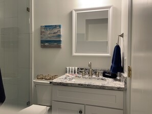 Combined shower/tub, hair dryer, towels, soap