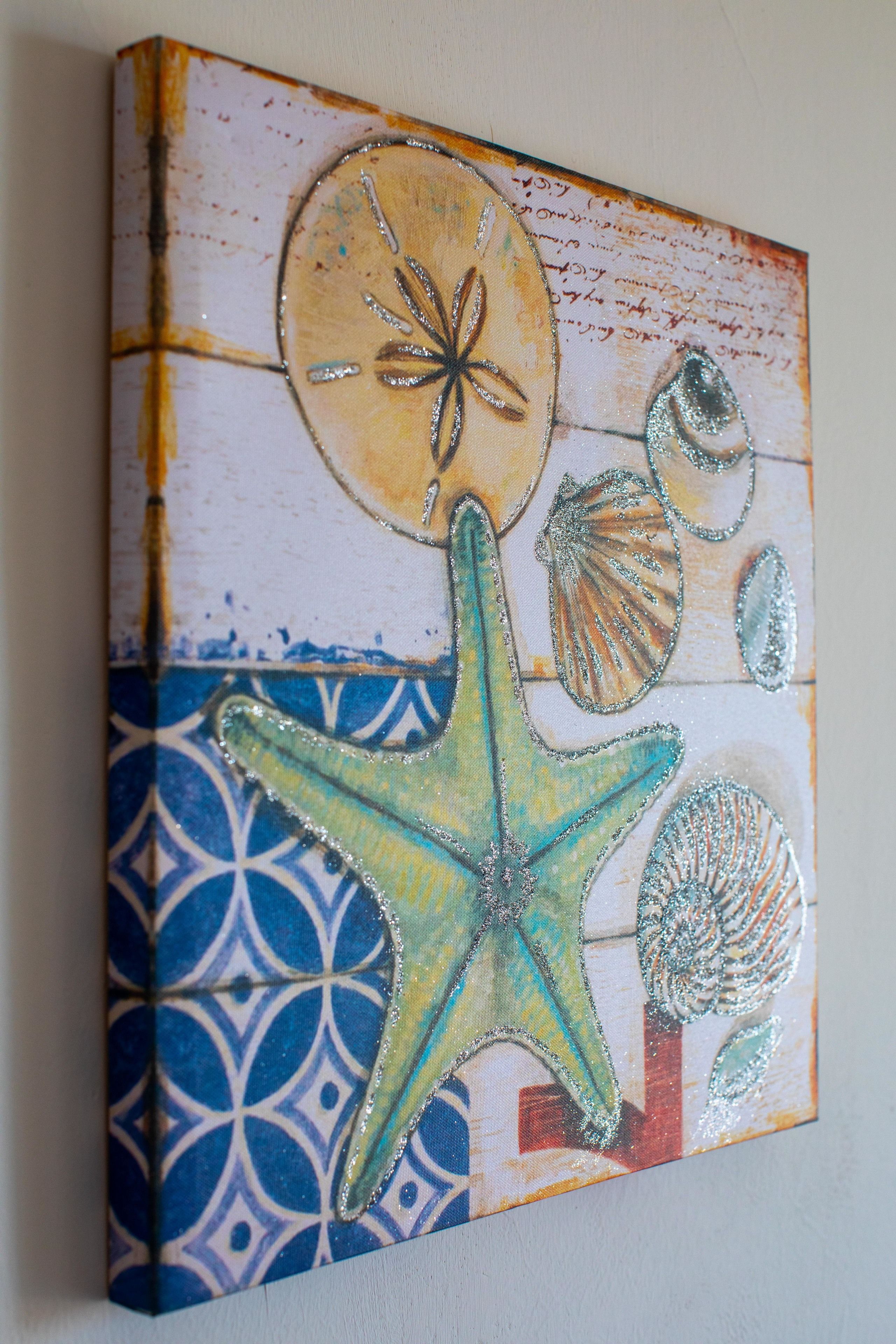 A textured wall with a nautical theme, featuring a starfish and seashells.