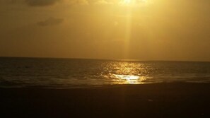 A sunset over the ocean with the sun's reflection on the water. - Dasa Beach View (Koggala)