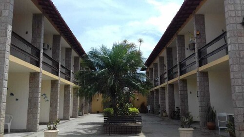 2-bedroom apartment with air conditioning very close to Praia do Forte beach.