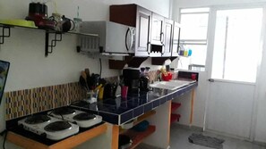 Fridge, microwave, stovetop, coffee/tea maker