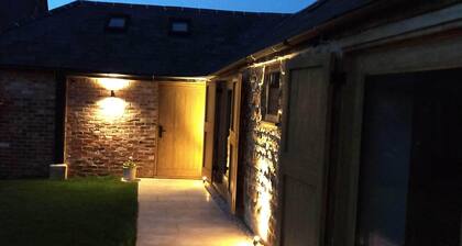 Luxury Barn conversion in village farm setting.