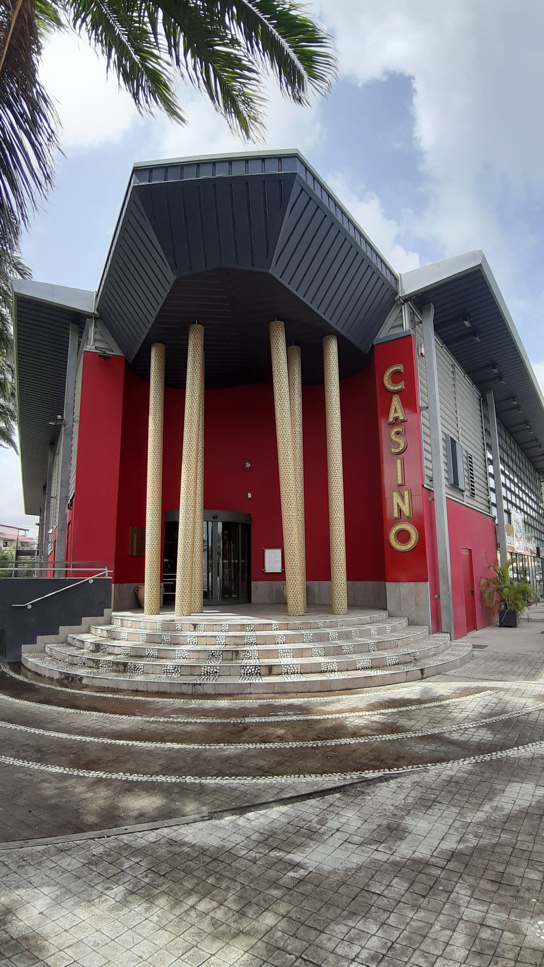 A building with a red facade and the word "CASINO" on the side.