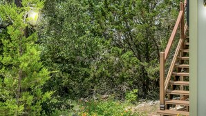 A pathway leading to a building with a sign reading "DISTANT VIEWS B&B." - Distant Views | Incredible Views | Gas Fireplace | Queen Bed (Fredericksburg)