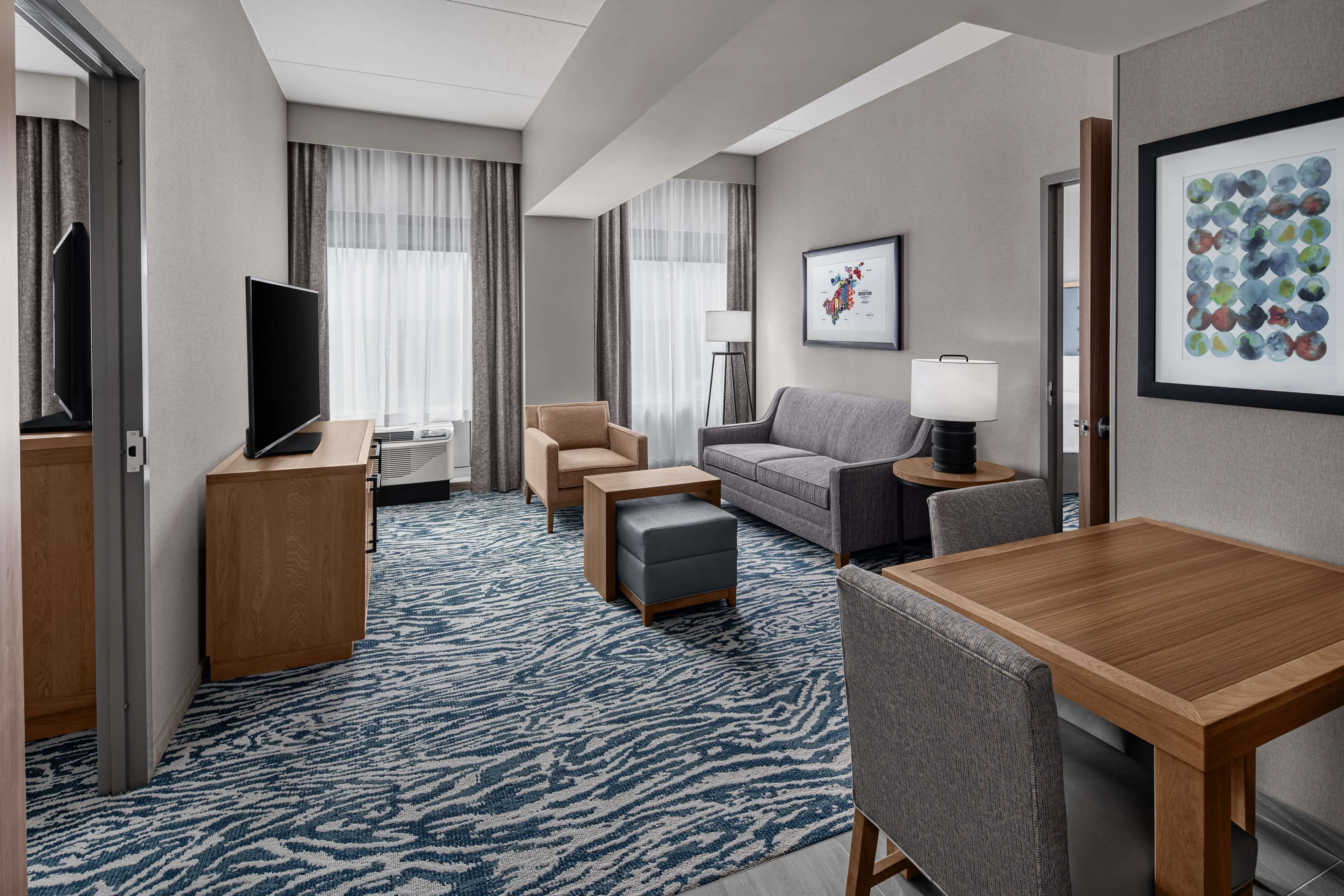 suite, multiple beds | living area | flat-screen tv