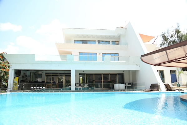 Outdoor pool, pool umbrellas, sun loungers