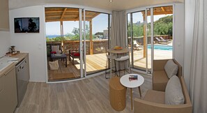 Luxury Chalet, 4 Bedrooms, Sea View | Living area | 80-cm flat-screen TV with satellite channels, TV - Camping Au Paradis des Campeurs (Roquebrune-sur-Argens)