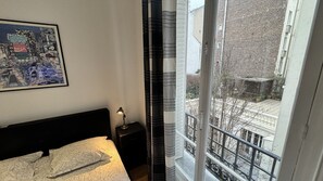 1 bedroom, desk, iron/ironing board, travel crib