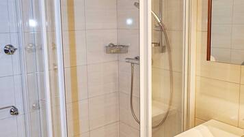 Combined shower/tub, hair dryer, towels, soap