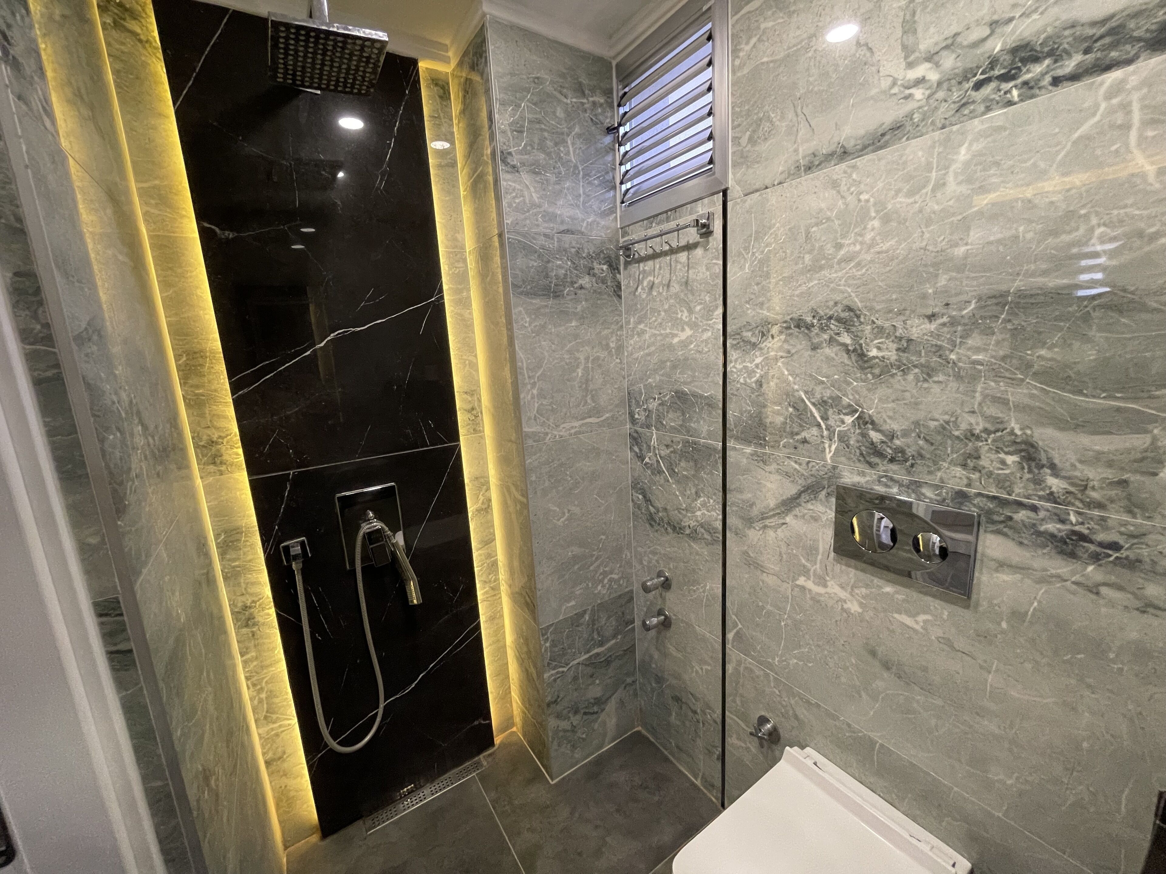 Shower, hair dryer, towels, toilet paper