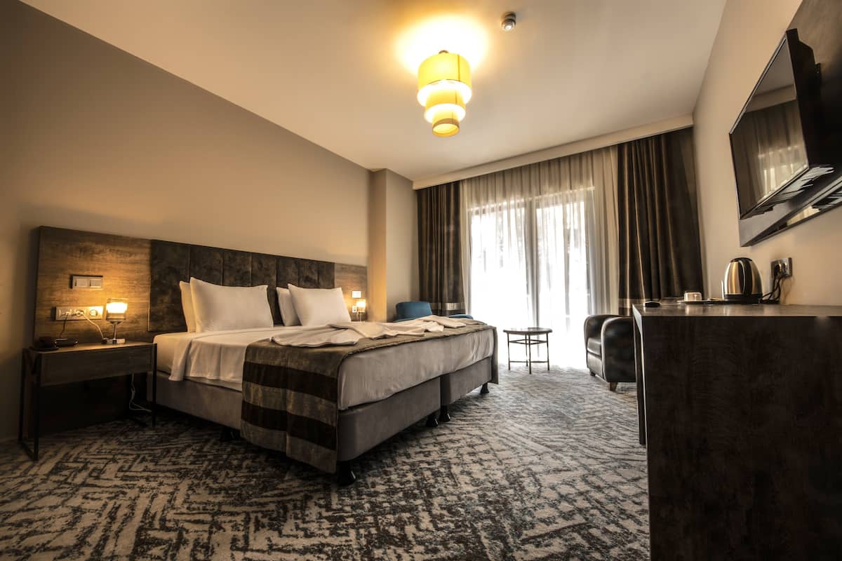 Habitación estándar | Sábanas de algodón egipcio, ropa de cama de alta calidad y minibar