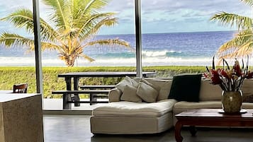 Beachfront Villa 1 | Living area | Flat-screen TV