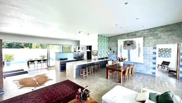 Beachfront Villa 1 | Living area | Flat-screen TV