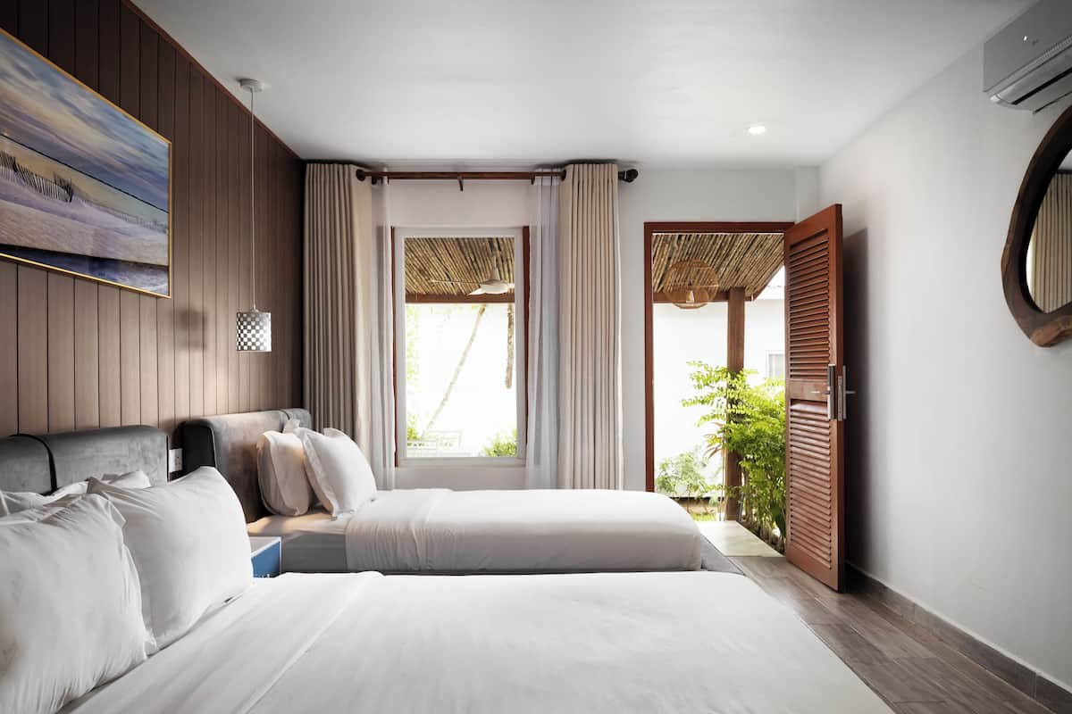 Deluxe Family Garden View | 2 bedrooms, minibar, desk, laptop workspace