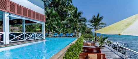 Outdoor pool, pool umbrellas, sun loungers