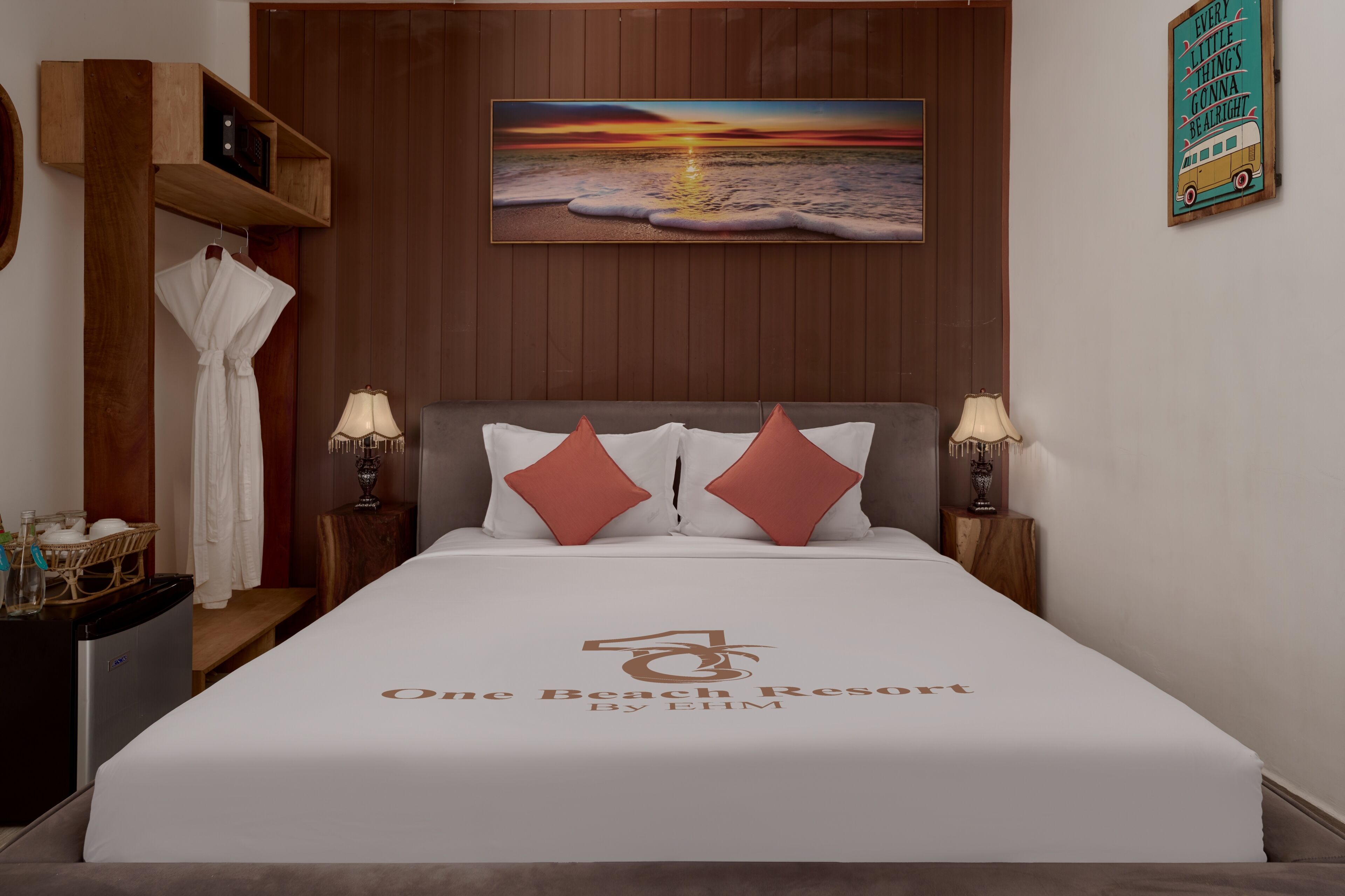 A hotel room with a bed, two nightstands, a wall-mounted painting, and a wooden shelf.