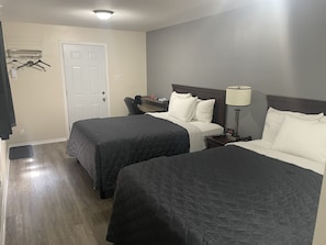 Economy Double Room, 2 Queen Beds | Desk, laptop workspace, blackout drapes, soundproofing - Nites Inn Motel (Cornwall)
