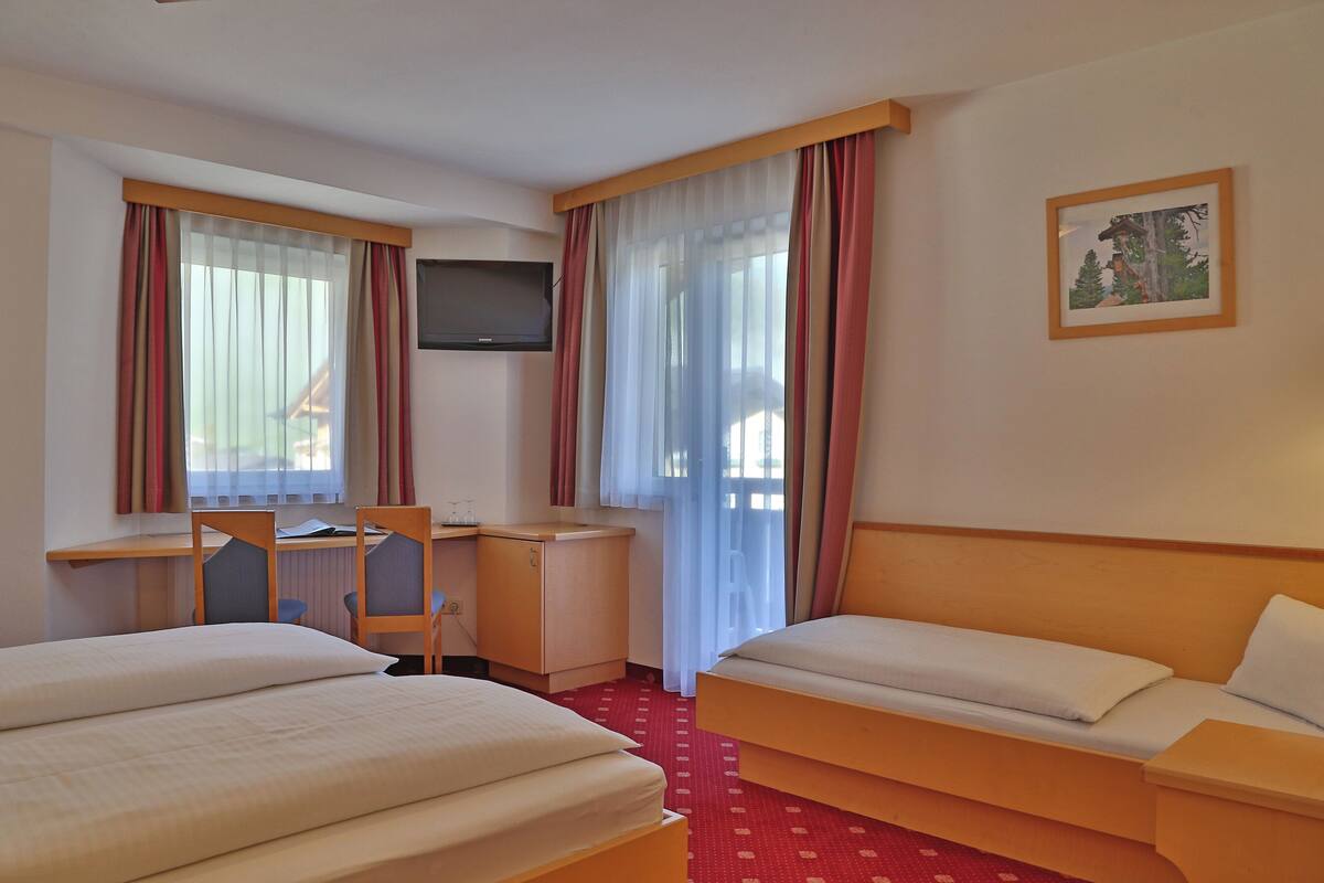 Triple Room | In-room safe, desk, laptop workspace, blackout curtains