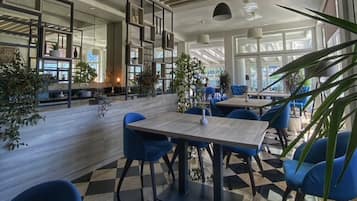 Breakfast, dinner served; international cuisine, beach views