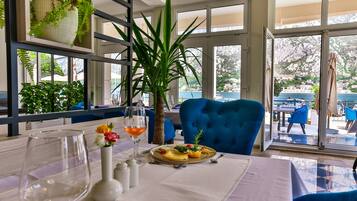 Breakfast, dinner served; international cuisine, beach views