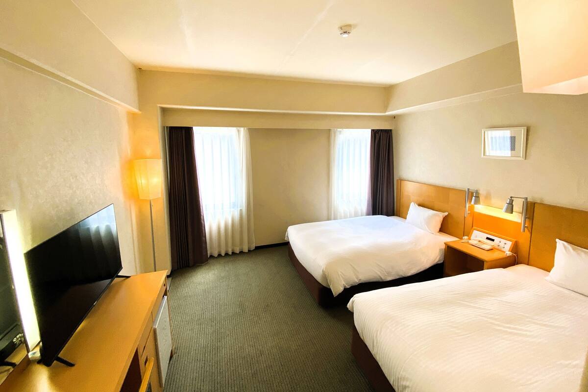 Premium bedding, down comforters, desk, laptop workspace