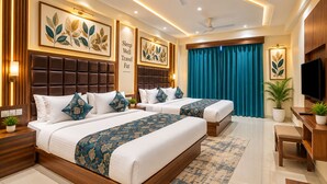A hotel room with two beds, a television, a desk, and a large window with curtains. - Hotel Royal Square, Ahmedabad (Ahmedabad)