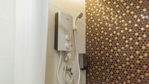 A shower area with a control panel and a shower head. - Red City Hotel (Lawas)