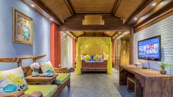 Quarto casal com design assinado | Área de estar | TV