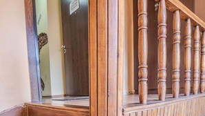 A wooden staircase with a handrail and a door at the top. - Vitosha Flat (Sofia)