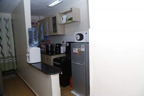 Apartment, 1 Bedroom | Private kitchen | Fridge, microwave, oven, electric kettle