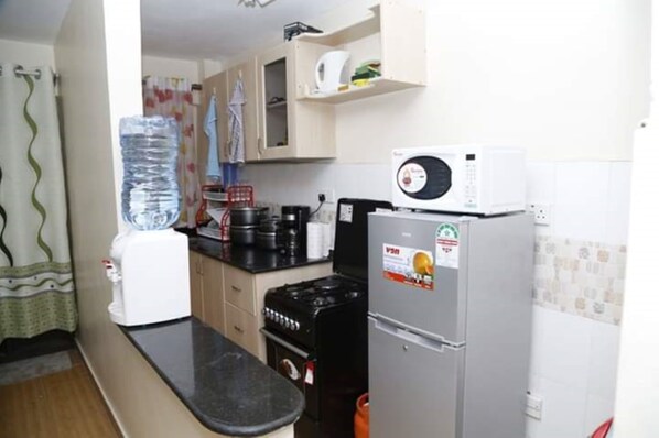 Apartment, 1 Bedroom | Private kitchen | Fridge, microwave, oven, electric kettle - Plainsville Apartments (Nairobi)
