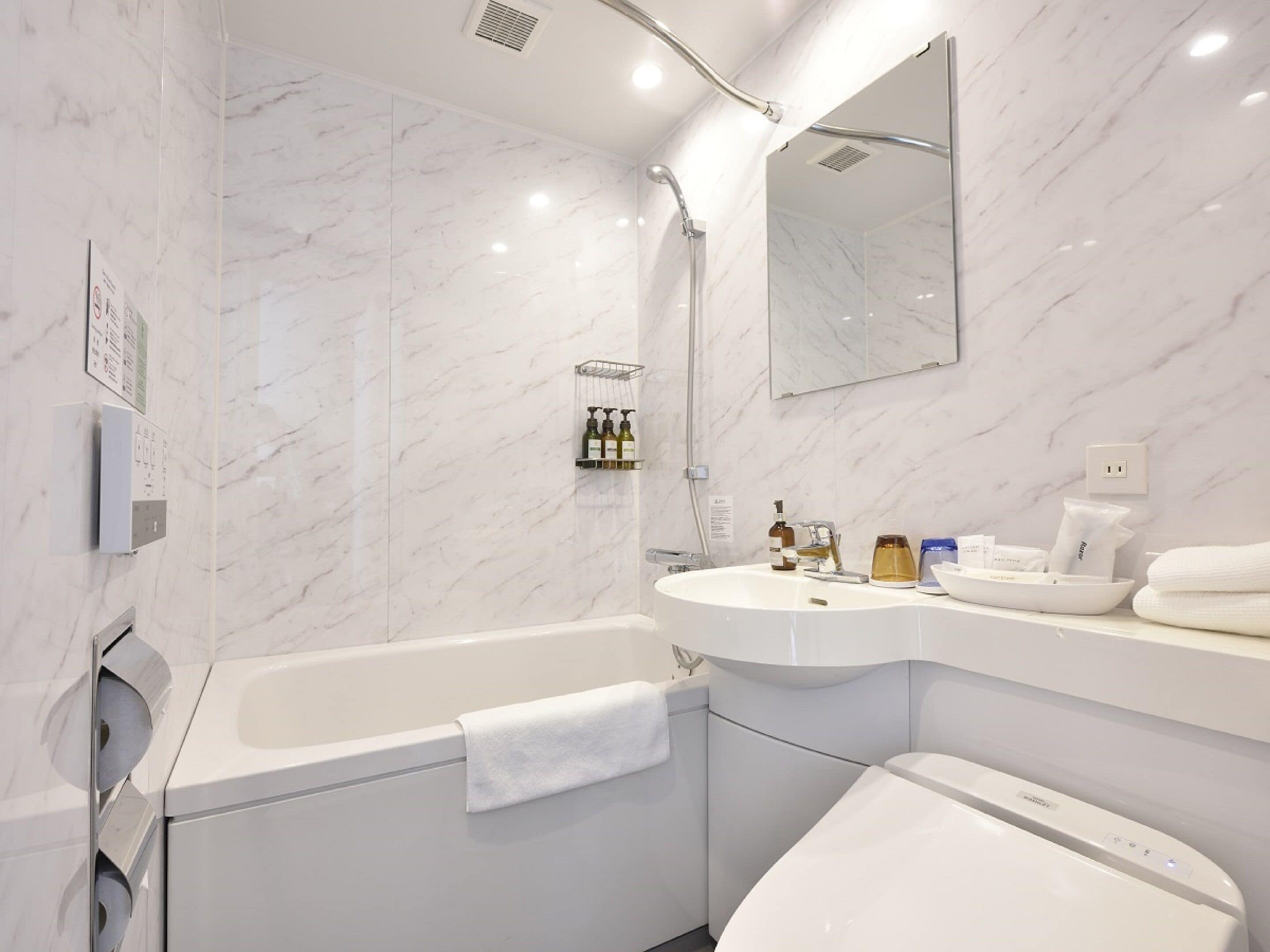 combined shower/bathtub, free toiletries, hair dryer, slippers