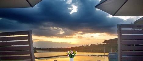 Outdoor pool, an infinity pool, sun loungers