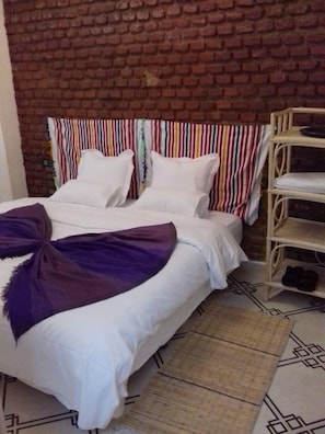 Basic Triple Room, Multiple Beds, Non Smoking | Free WiFi, bed sheets