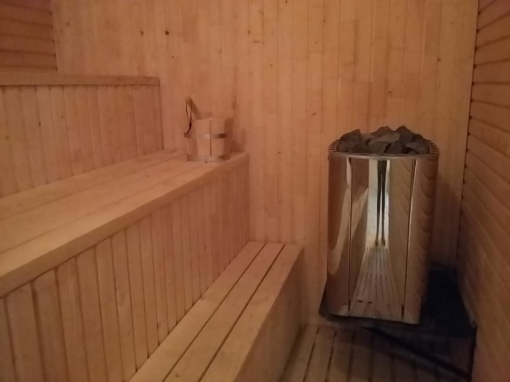 A sauna with wooden walls and benches.