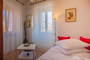 Apartamento, 2 quartos | Ferros/tábuas de passar roupa, Wi-Fi de cortesia, roupa de cama