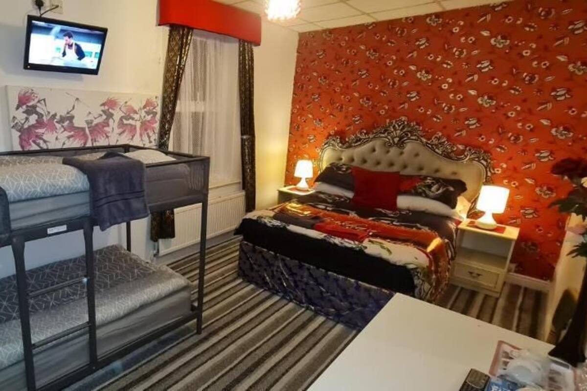 RM3 Family Room | Bathroom | Hair dryer, towels, soap, toilet paper