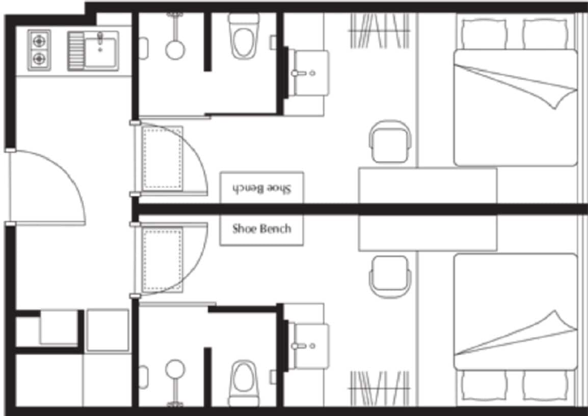A hotel room layout with a bathroom, a shoe bench, and a bed.