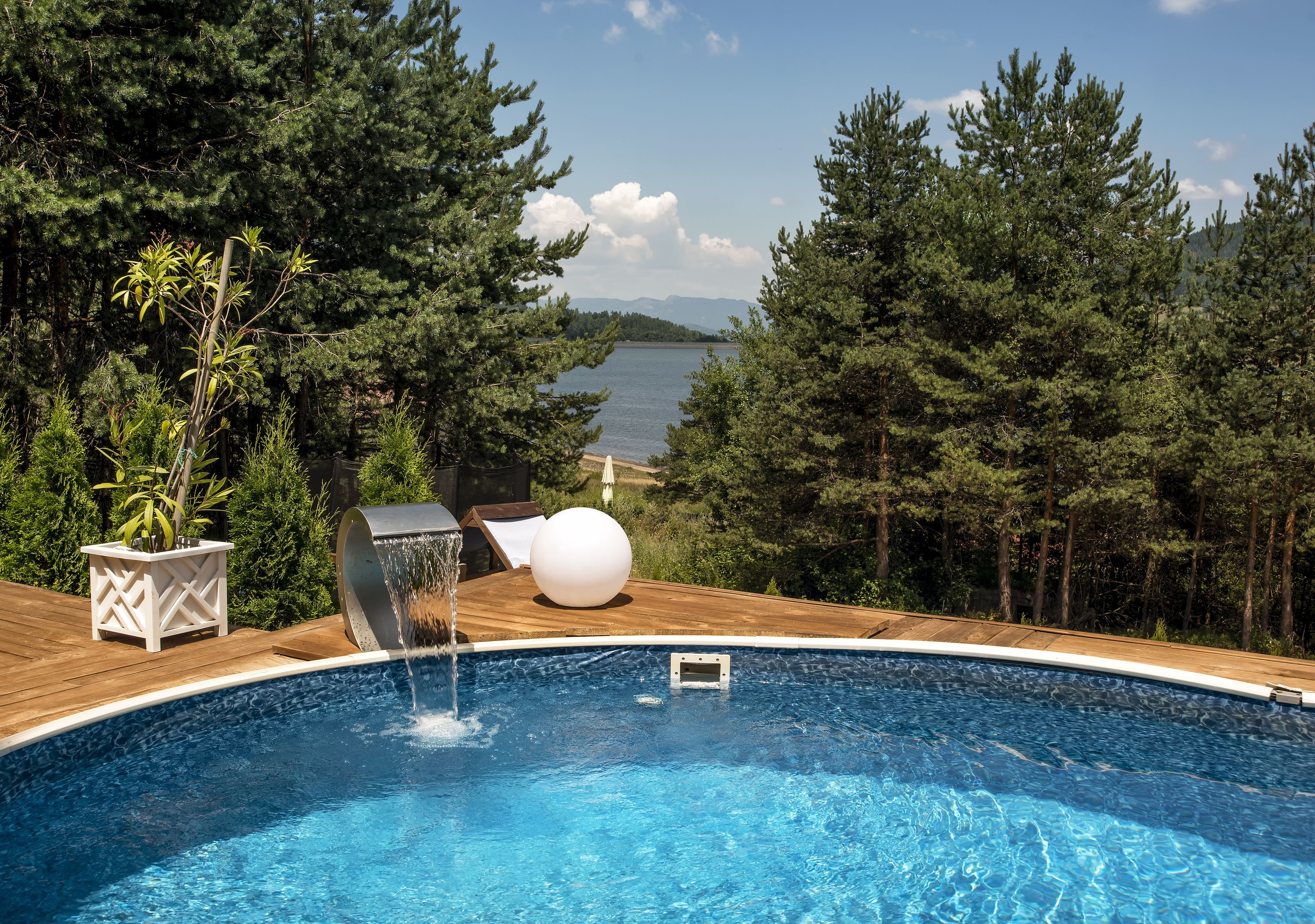 Seasonal outdoor pool, pool umbrellas, pool loungers