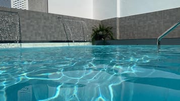 Seasonal outdoor pool, pool umbrellas, pool loungers