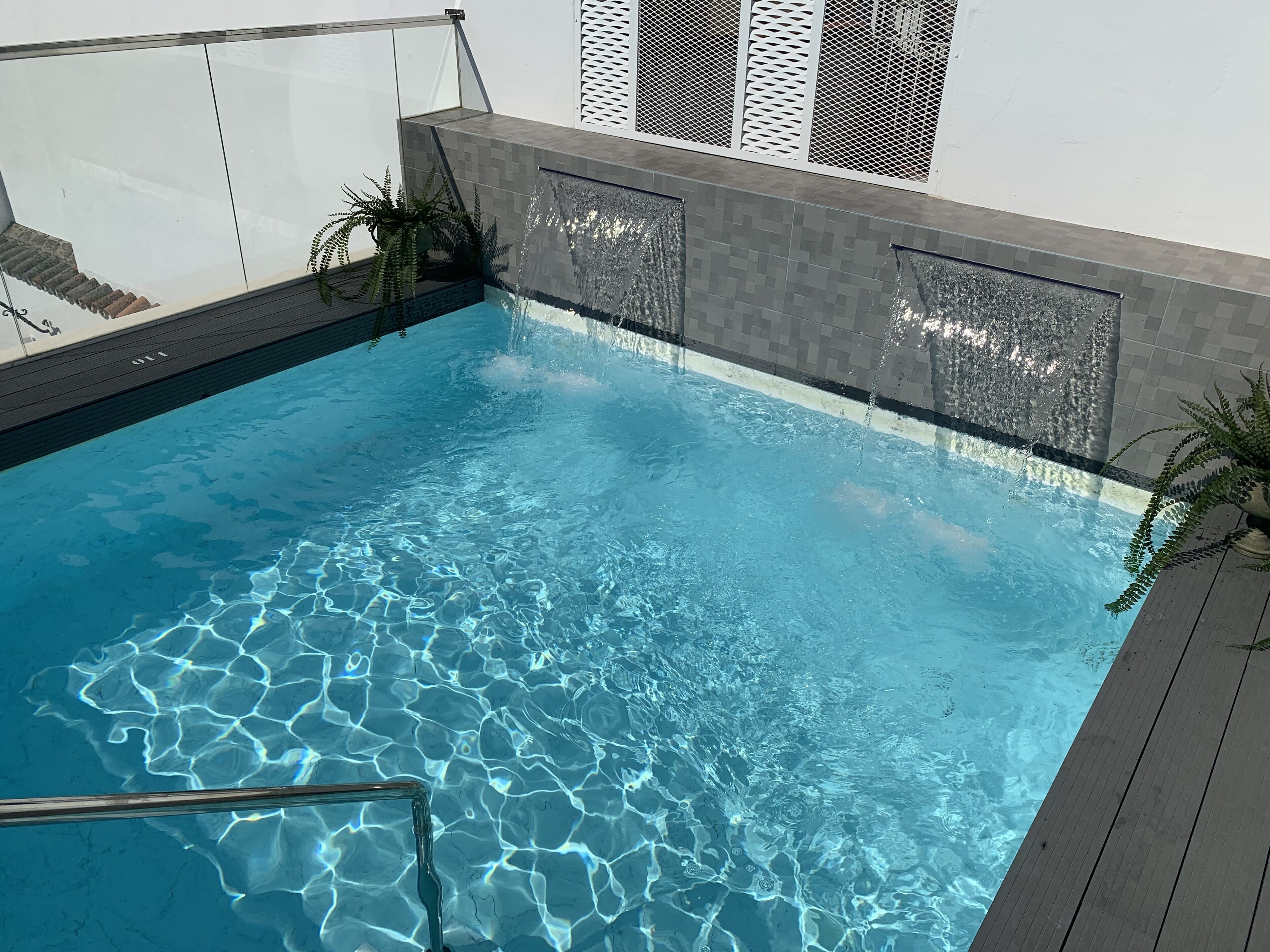 seasonal outdoor pool, pool umbrellas, pool loungers