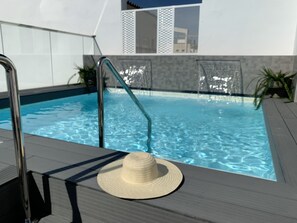 Seasonal outdoor pool, pool umbrellas, pool loungers
