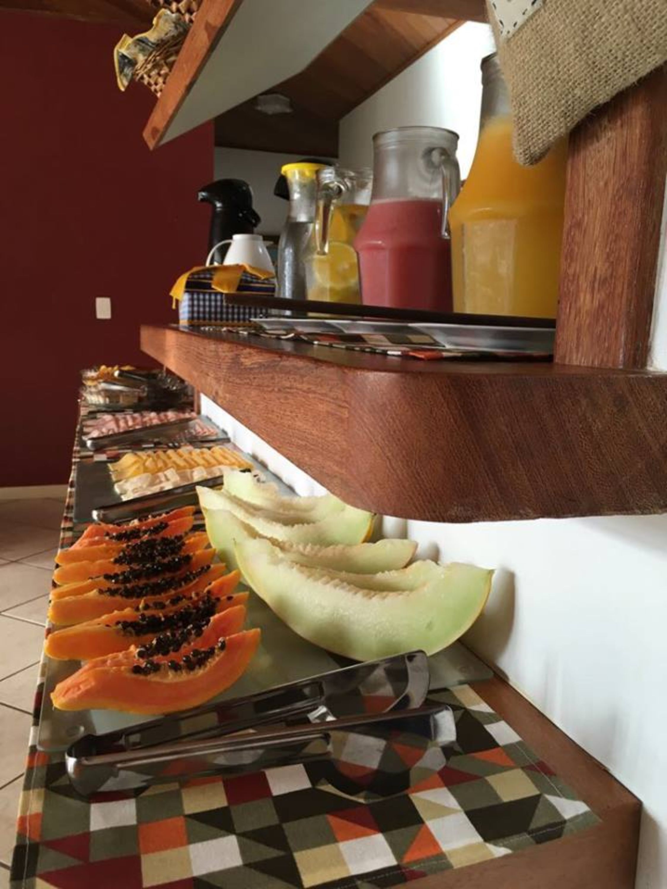A buffet setup with various food items and condiments.