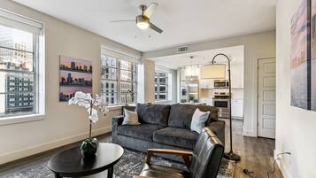 Premium Condo, 1 Bedroom | Living room | 65-inch flat-screen TV with digital channels, TV, foosball