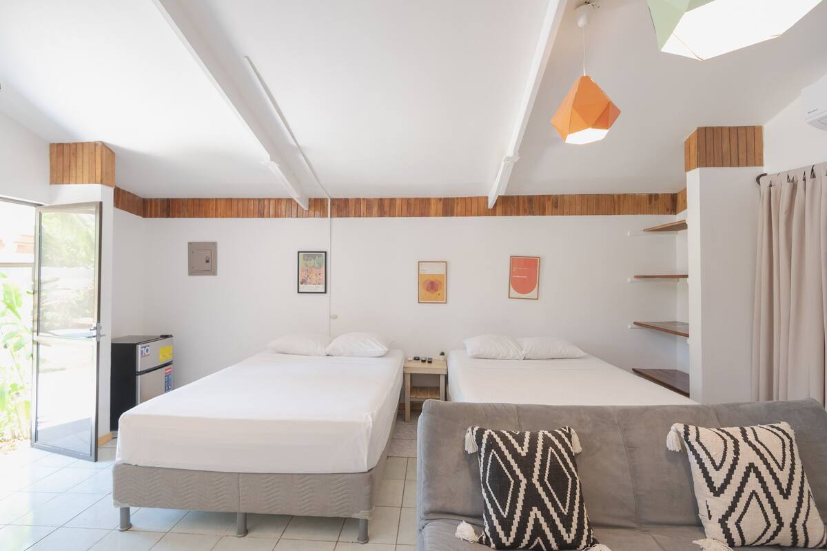 Premium bedding, memory foam beds, in-room safe, laptop workspace
