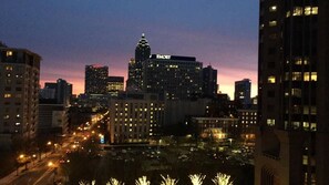 A city skyline at dusk with illuminated buildings, including a prominent EMORY building. - The MIdtown Atlanta Escape (Atlanta)